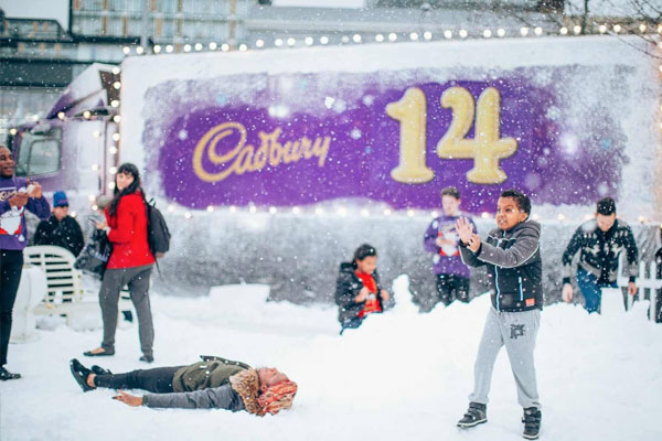 Families enjoy the real snow in this Cadbury pop up event