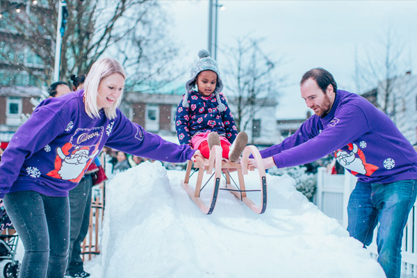 A child sledges on real snow made for Cadbury by Snow Business