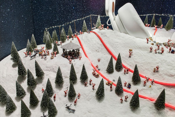 Close up of fine fake snow and miniature trees in Selfridge's shop window 